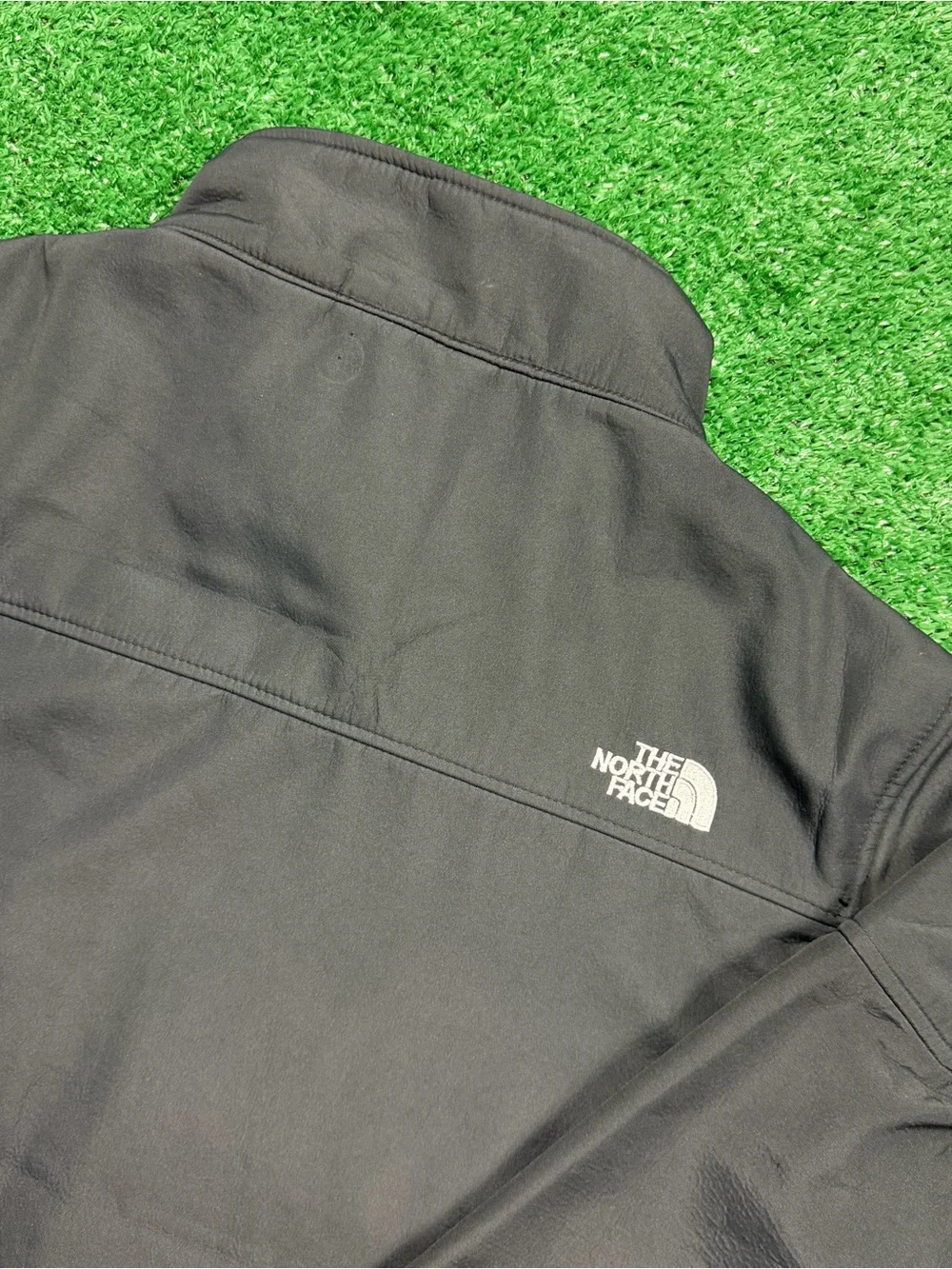 The North Face Black Jacket with Blue Zipper Accents